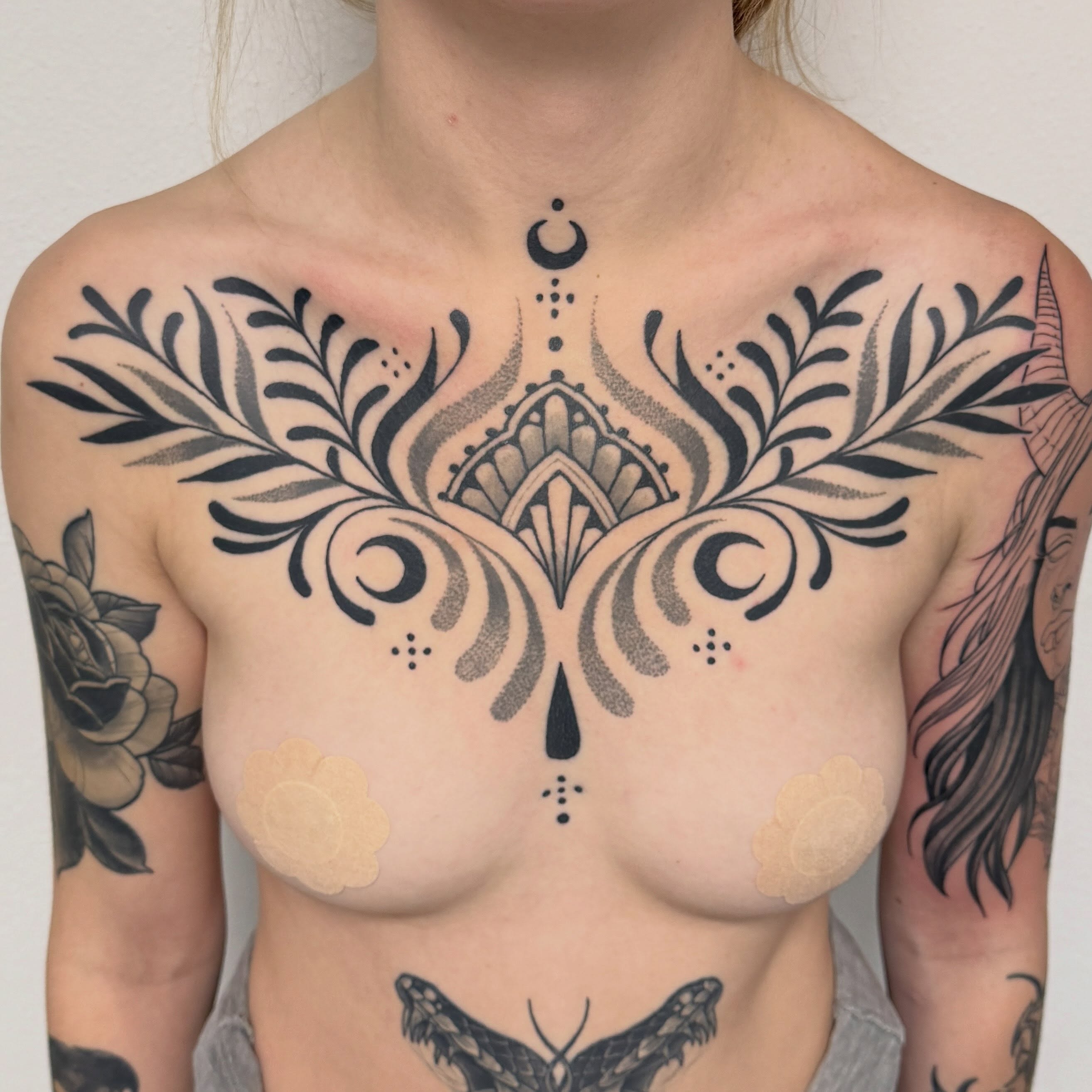 Ornamental chest tattoo · healed